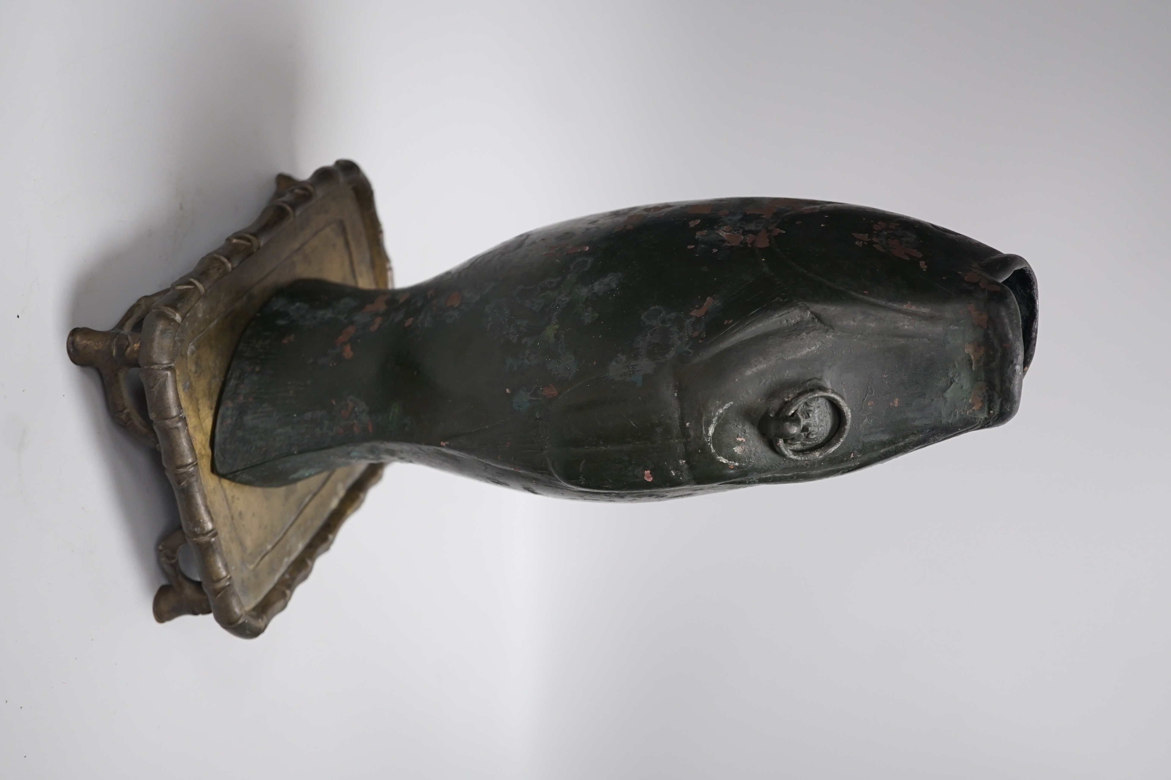 A bronze fish-shaped vase and an associated Chinese rectangular bronze stand, 32cm